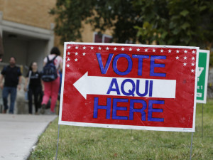 A sign shows the way to a polling station in Austin, Texas. A federal appeals court has knocked down a state voter ID law. Erich Schlegel/Getty Images